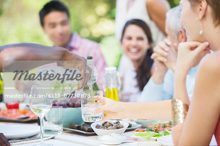 Friends eating together outdoors