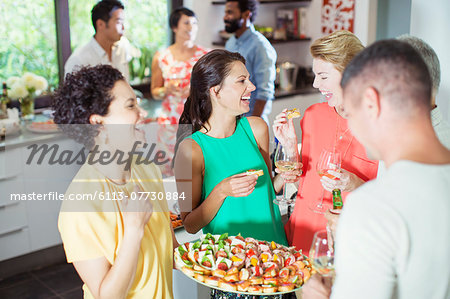 Woman serving friends at party