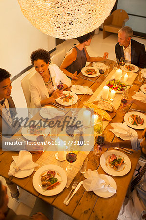 Friends eating together at dinner party