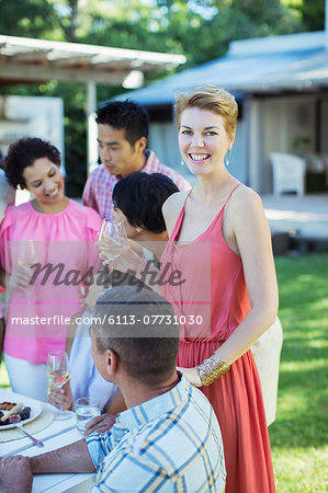 Woman smiling at party outdoors