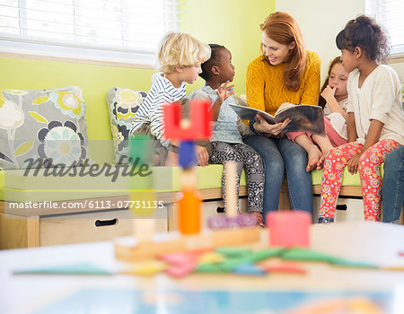 Teacher and students reading in classroom