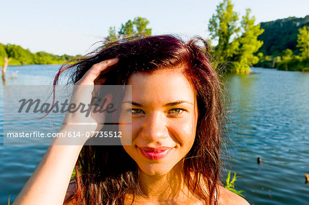 Portrait of young woman with hand in her hair, Delaware Canal State Park, New Hope, Pennsylvania, USA