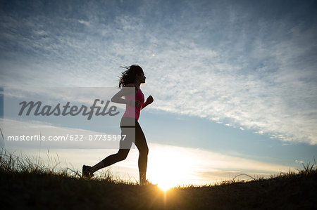 Young Girl Running On The Sand