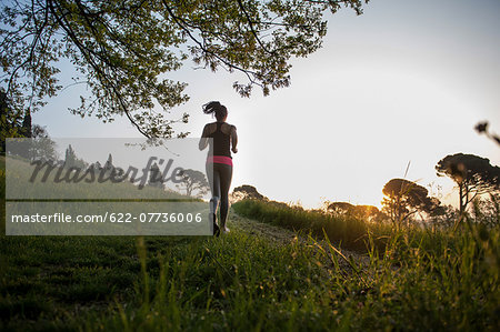 Young Girl Running In A Park