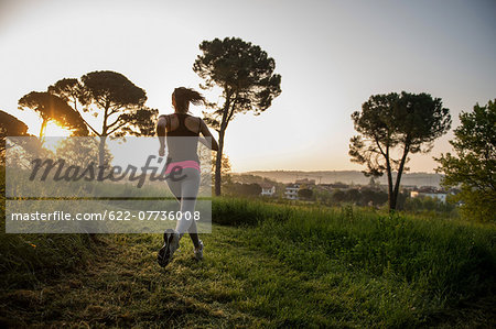 Young Girl Running In A Park