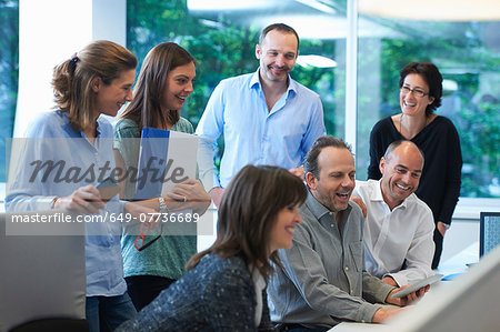 Businesspeople meeting around desk