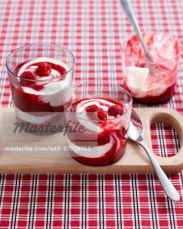 Raspberry swirl desserts garnished with fresh raspberries