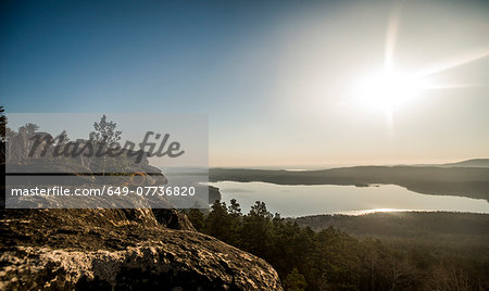 View of rock formation and distant lake View of rock formation and distant lake