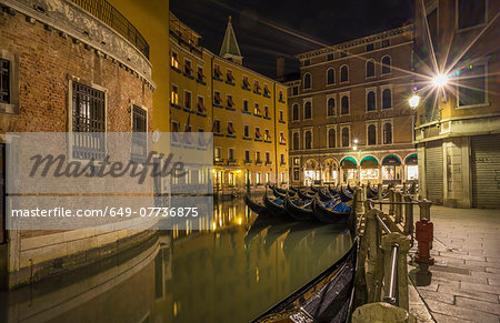 Canal and gondolas at night, Venice, Veneto, Italy