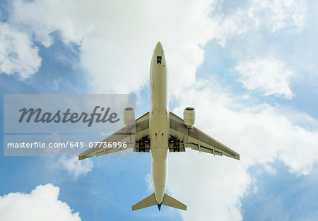 Aeroplane approaching Amsterdam Airport Schiphol, viewed from below