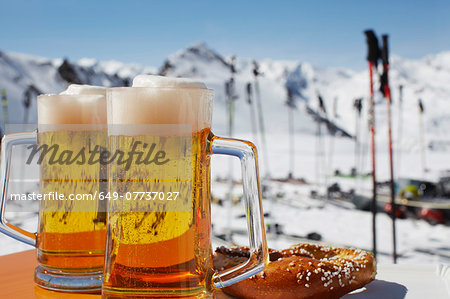 Two glasses of beer on outdoor cafe table, Austria Two glasses of beer on outdoor cafe table, Austria