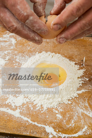 An egg in a pile of flour