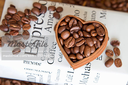 Coffe beans in a heart-shaped bowl