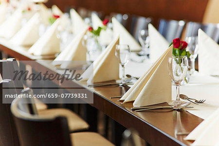 A table laid for a wedding reception in a restaurant