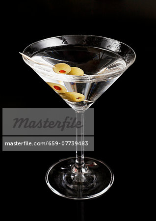 A martini against a black background