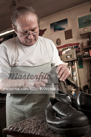 Cobbler working in workshop Cobbler working in workshop