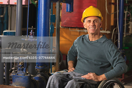 Power plant engineer with spinal cord injury in demineralization process room