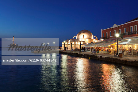 Lighthouse at Venetian port and Turkish Mosque Hassan Pascha at night, Chania, Crete, Greek Islands, Greece, Europe