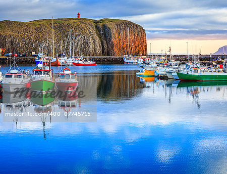 The colorful boats in peaceful Stykkisholmur's harbor in western Iceland