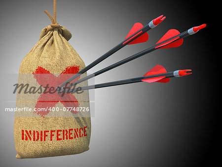 Indifference - Three Arrows Hit in Red Target on a Hanging Sack on Green Bokeh Background.