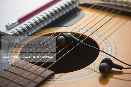 Headphones on guitar, Writing music