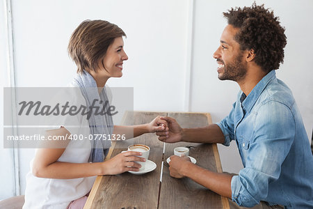 Casual couple having coffee together at the coffee shop