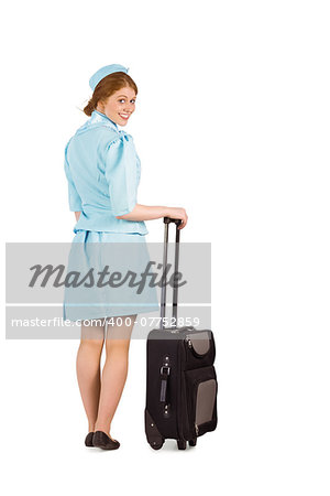 Pretty air hostess leaning on suitcase on white background