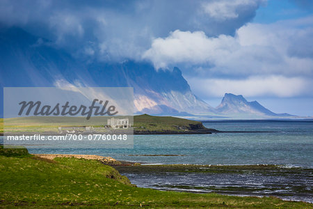 Scenic view of ruins and mountains, Hofn, Iceland