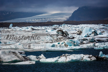 Scenic view of glacial ice in lake and glacier in background, Jokulsarlon, Iceland Scenic view of glacial ice in lake and glacier in background, Jokulsarlon, Iceland
