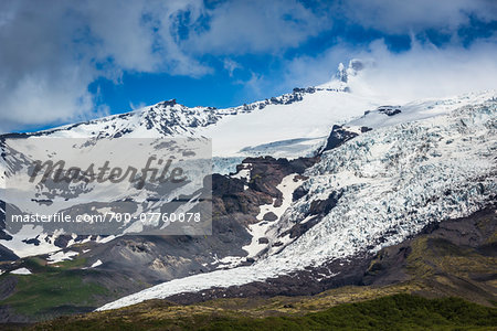 Scenic view of mountainside and glacier, Haalda, Iceland