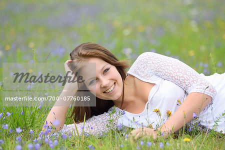 Close-up of a young woman in a flower meadow in summer, Upper Palatinate, Bavaria, Germany