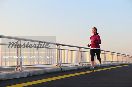 Young Japanese girl jogging