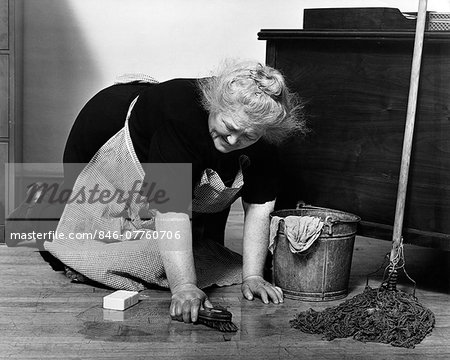 1930s SENIOR WOMAN CHARACTER CLEANING SCRUBBING FLOORS ON HANDS AND KNEES WITN SCRUB BRUS BUCKET MOP