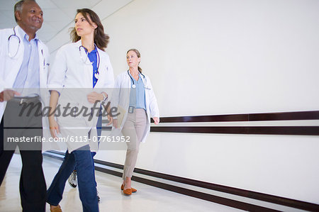 Doctors and nurses in hospital hallway