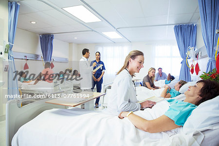 Doctors, nurses and patients in hospital room