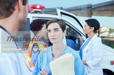 Doctor and nurse talking outside hospital