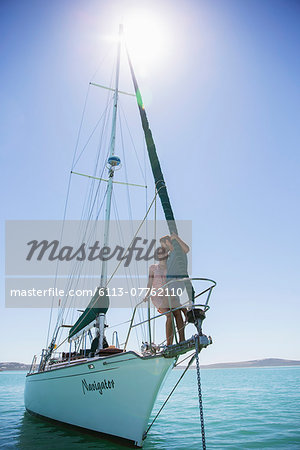 Couple standing on end of boat