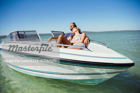 Couple sitting in boat on water