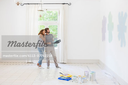 Couple looking at paint swatches together