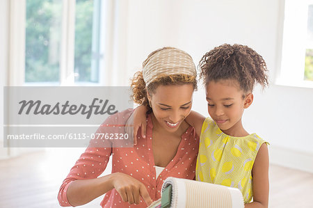 Mother and daughter looking through fabric swatches together