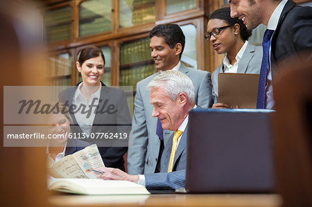 Lawyers examining document together