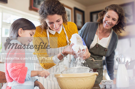 Three generations of woman baking together