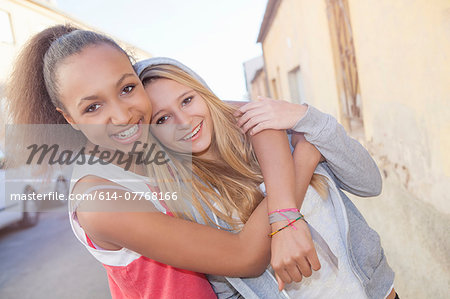 Teenage girls hugging