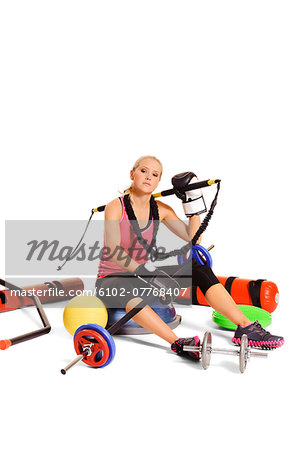 Young woman with training equipment, studio shot