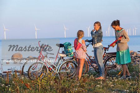 Mother with daughters cycling, Oland, Sweden
