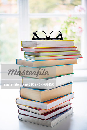 Pile of books with glasses on top, Sweden