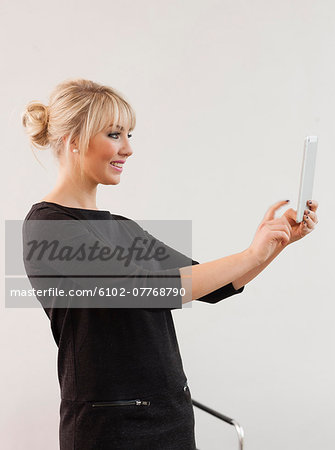 Young businesswoman with digital tablet