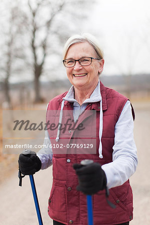 Senior woman with walking poles
