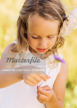 Girl holding flower