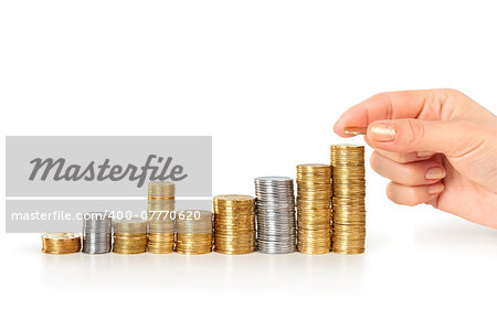 Hand putting a coin isolated on a blue background